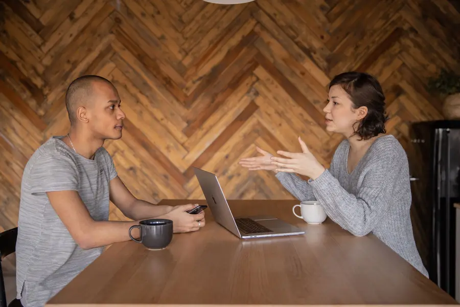 A talk at a kitchen table, as shot